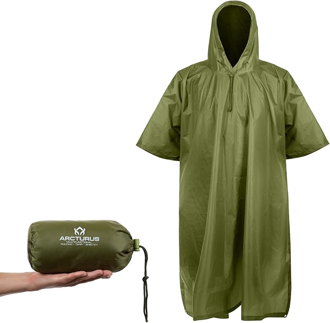 Arcturus Rain Poncho (Ripstop Nylon), shows the style of the poncho and the caring bag in the palm of someone's hand.